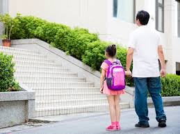 dad holding kids' hand
